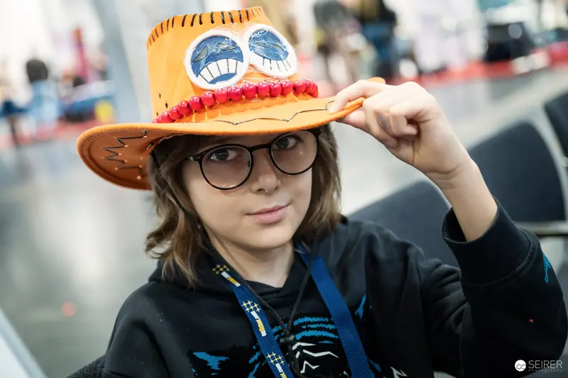 Young Attendee in Portgas D. Ace One Piece Cowboy Hat at Vienna Comic Con 2023