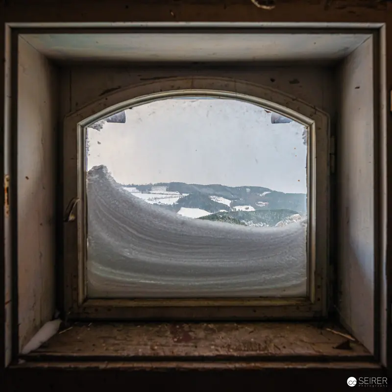 Frost-Covered Arched Window Framing Snowy Semmering Landscape, Südbahnhotel