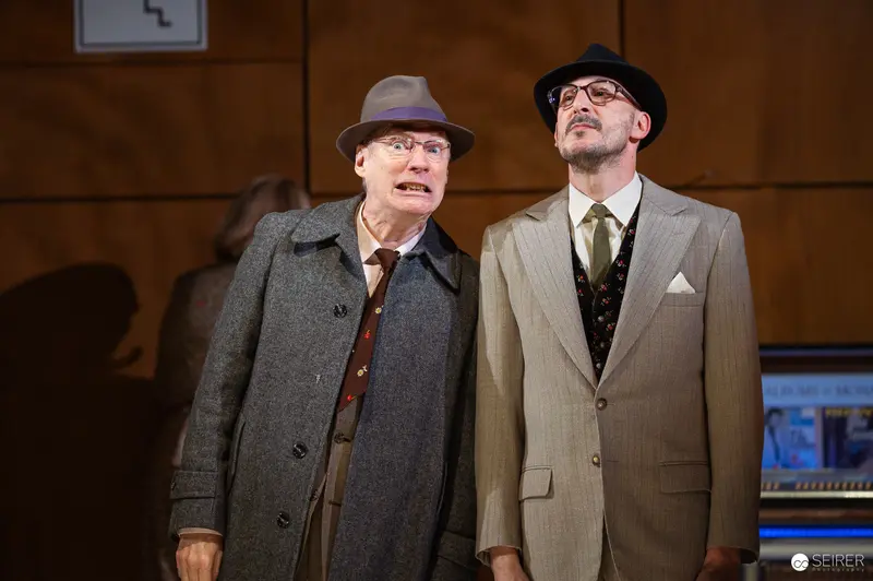 Theatrical Performance of Der Himbeerpflücker at Kammerspiele Featuring Two Actors in Period Attire