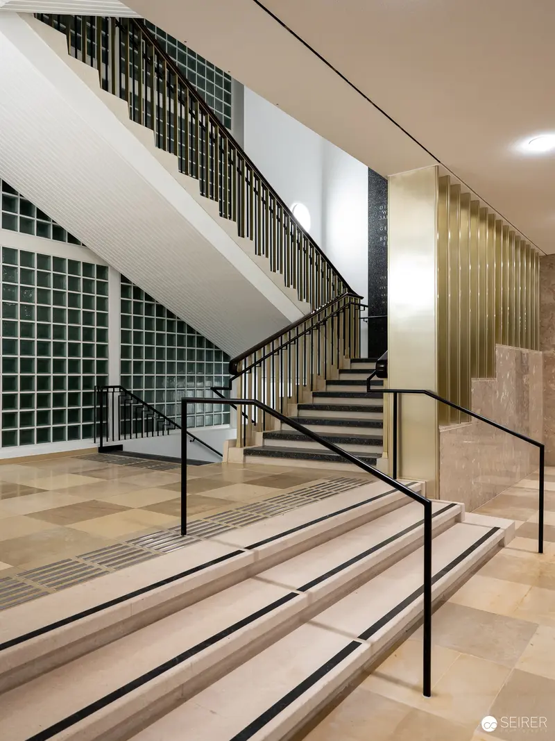 Modern Architectural Staircase with Geometric Tiled Wall at Wien Museum Renovation