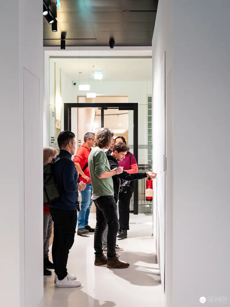 Wien Museum Preopening Attendees Discuss Renovation in Doorway