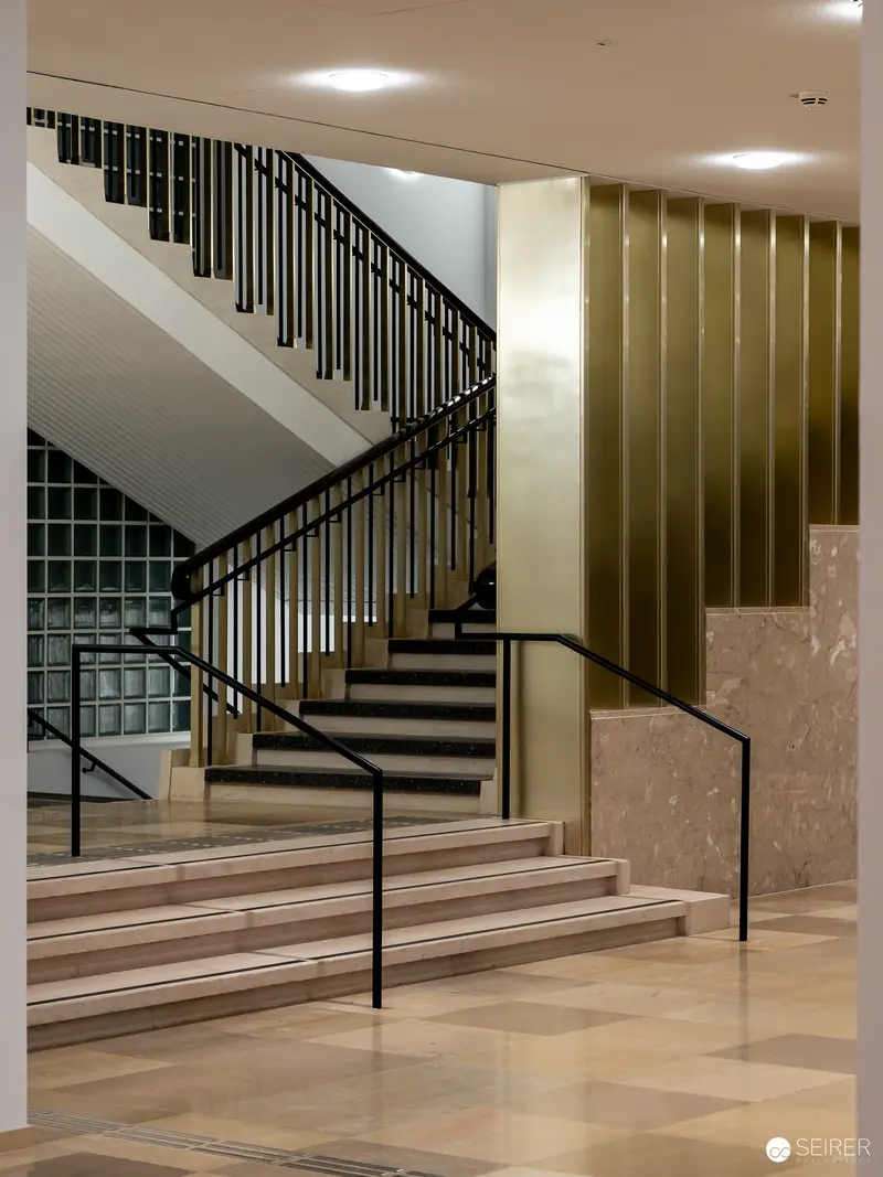 Wien Museum Renovation: Elegant Interior Staircase with Modern Design Elements