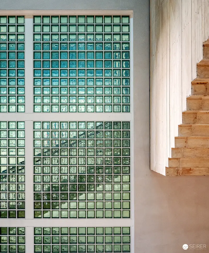 Glass Block Window Design with Wooden Staircase in Modern Interior