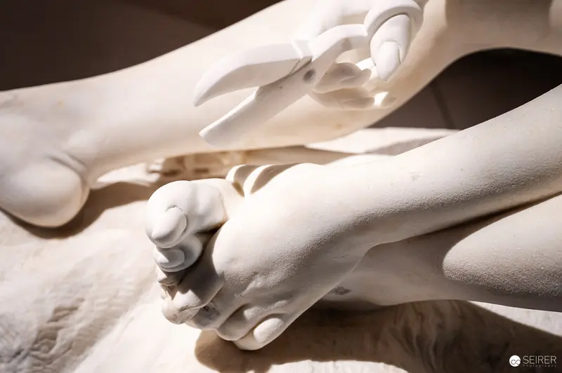 Detailed White Sculptural Hand Rendering in Monochromatic Ceramic Tone