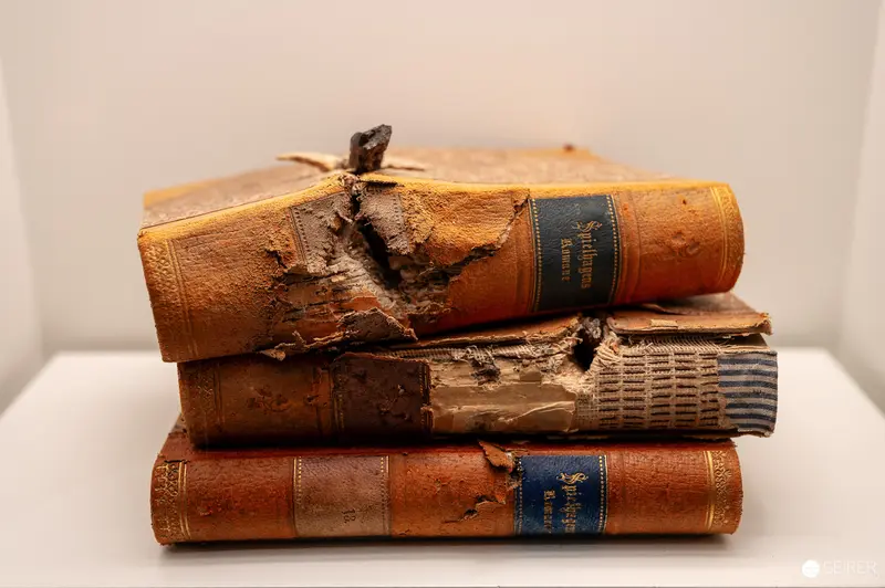 Damaged Antique Books Stacked Showing Aged Leather Bindings and Wear