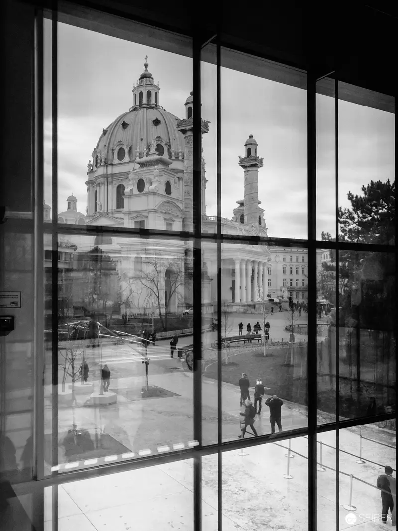 Wien Museum Interior: Baroque Architecture Framed by Modern Glass Windows
