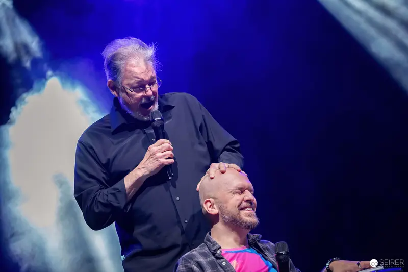 Comedic Performance at Vienna ComicCon 2023 Stage Featuring Stand-up Comedy