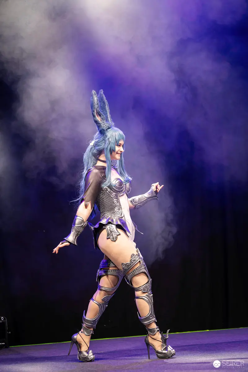 Blue-Haired Cosplay Performer on Stage at Vienna ComicCon 2023