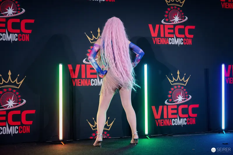 Pink-Haired Cosplayer Posing at Vienna Comic Con 2023 VIECC