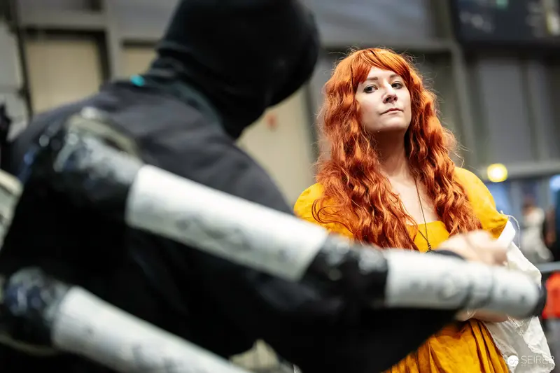 Cosplayer in Vibrant Yellow at Vienna ComicCon 2023