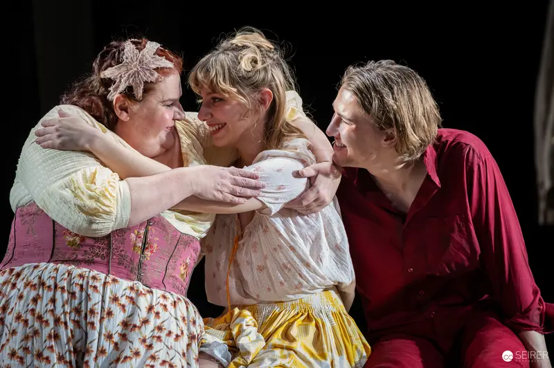 Three Performers in Period Costumes During "Es muß geschieden sein" Rehearsal