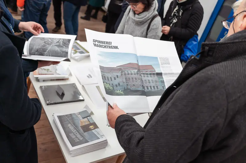 Diplomausstellung der Prager Fotoschule: Participants Reviewing Photography Exhibition Materials