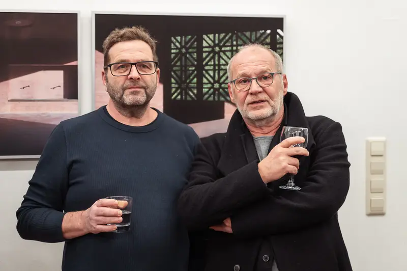 Two Gentlemen at Art Gallery Exhibition Opening with Wine Glasses