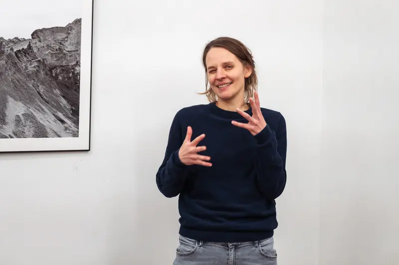 Hannah Mayr Gesturing During Prague Photo School Diploma Exhibition Presentation
