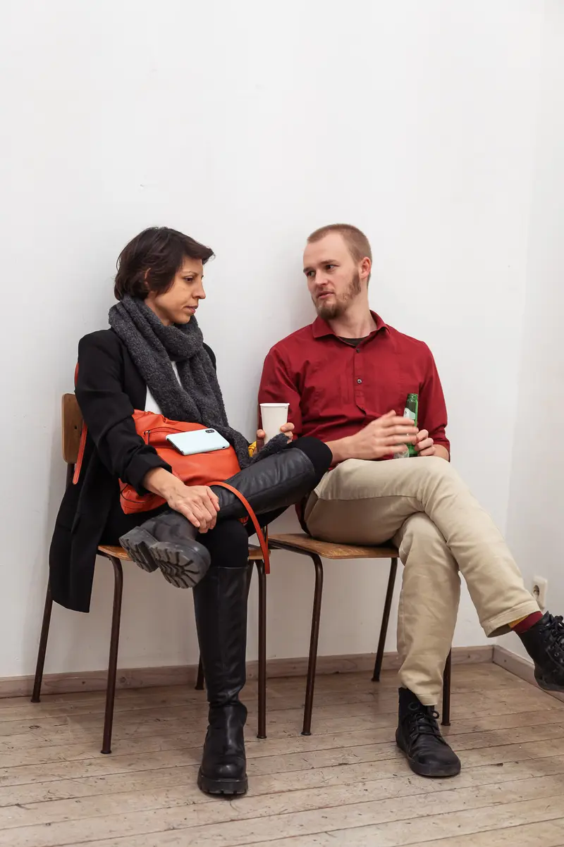 Two Participants in Conversation During Prague Photography School Diploma Exhibition
