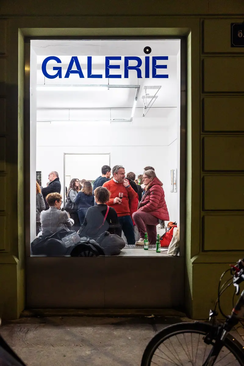 Diplomausstellung der Prager Fotoschule: Gallery Gathering in Evening Light