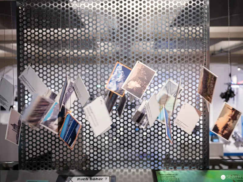 Photo Collage on Perforated Metal Screen at Energy Transition Exhibition