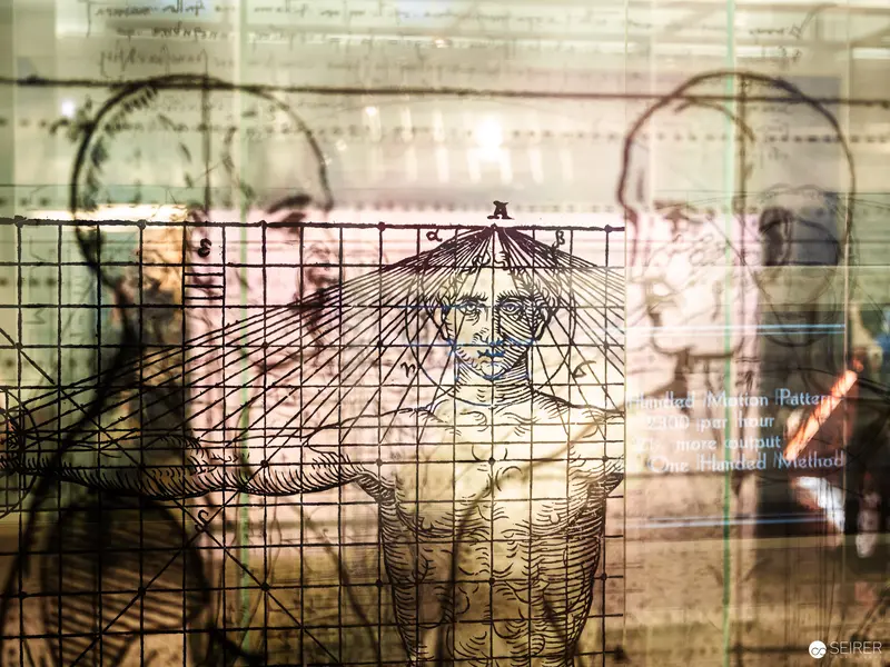 Geometric Human Form Trapped in Layered Archival Grid Projection