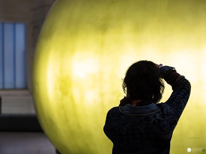 Silhouetted Figure Explores Energy Transition Exhibit at Vienna Technical Museum