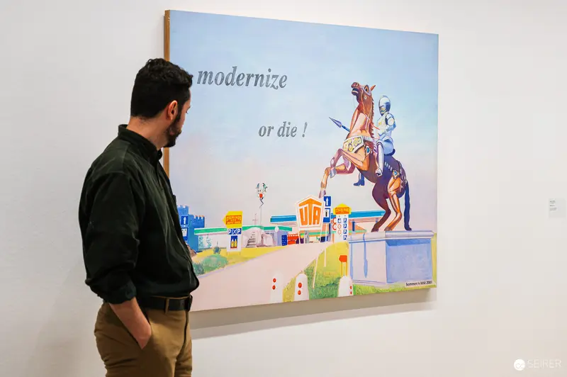 Modernization Critique: Gallery Visitor Observes Bold Artwork at MUSA Exhibition