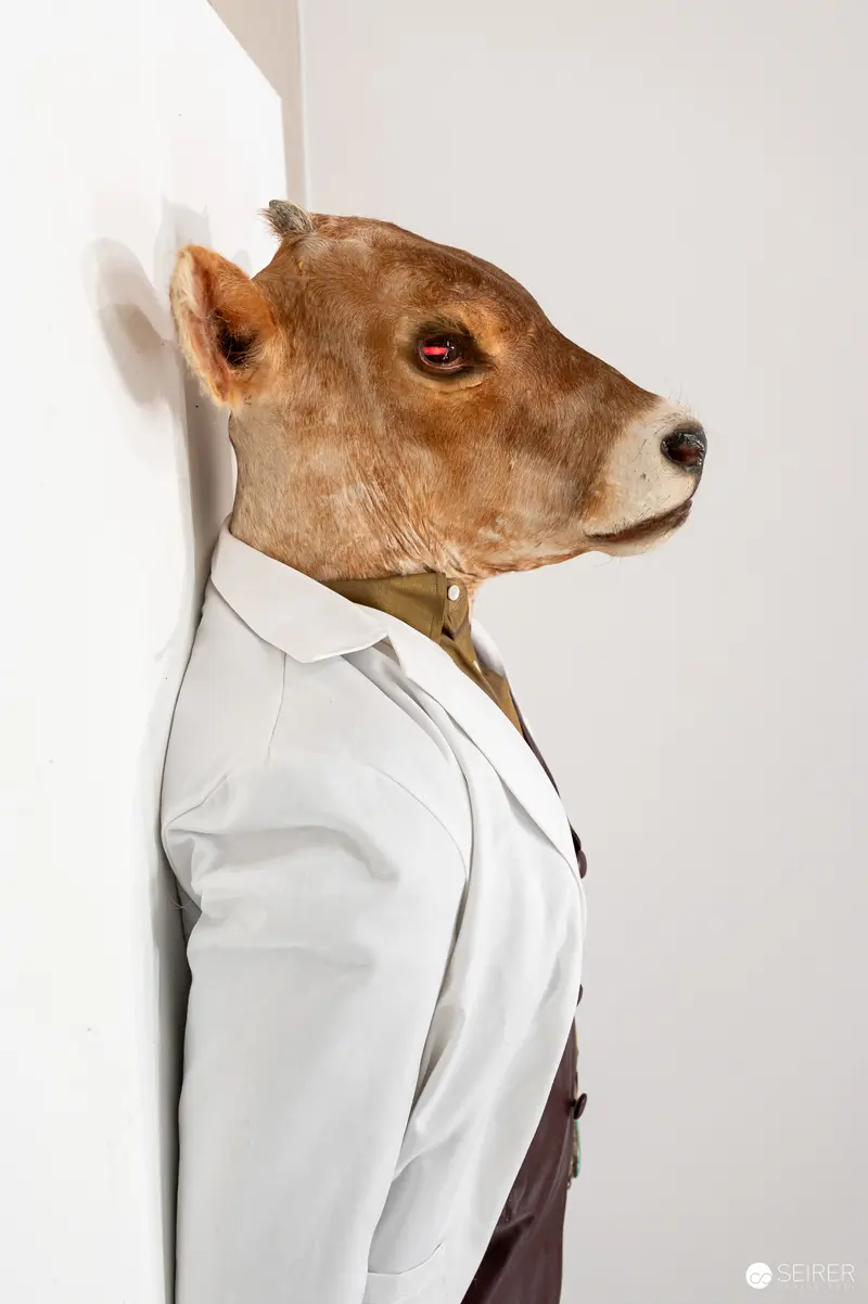 Anthropomorphic Dog Portrait in White Blazer Leaning Against Wall