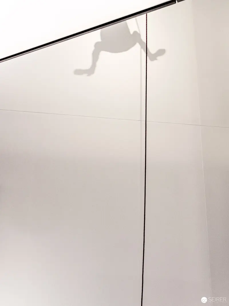 Shadow Silhouette on White Wall in Gallery Exhibition