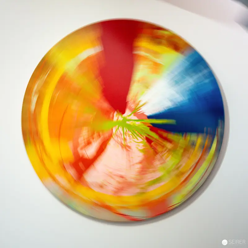 Colorful Abstract Circular Artwork with Radial Blurred Color Spectrum