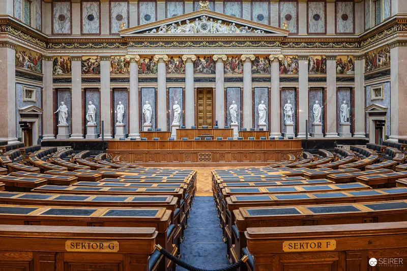 Historic Austrian Parliament Interior: Neoclassical Legislative Chamber with White Statues
