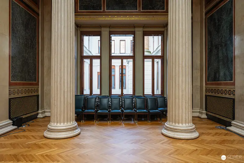 Classical Interior of Austrian Parliament Building with Neoclassical Columns and Chairs