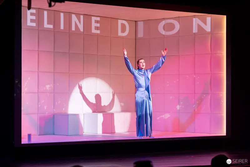 Celine Dion Performing in Blue Outfit on Large Illuminated Stage