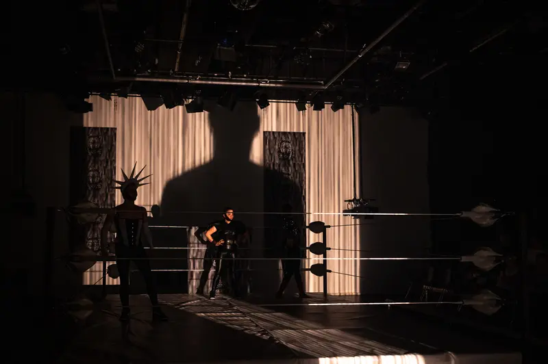 Silhouetted Figure on Stage During "Keeping up with the Penthesileas" Theater Performance
