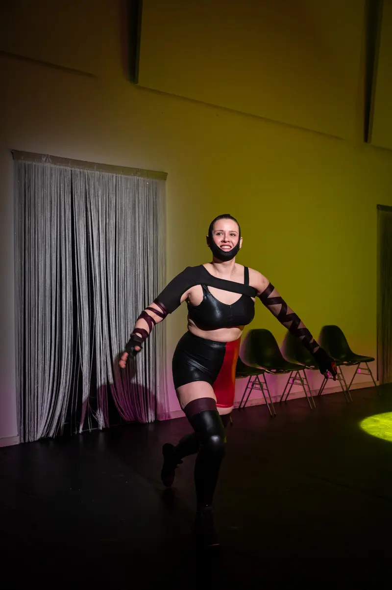 Performative Pose in Black Ensemble at Kosmos Theater Wien