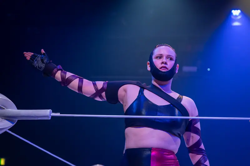 Performer in Striking Pose During "Keeping up with the Penthesileas" Theater Production