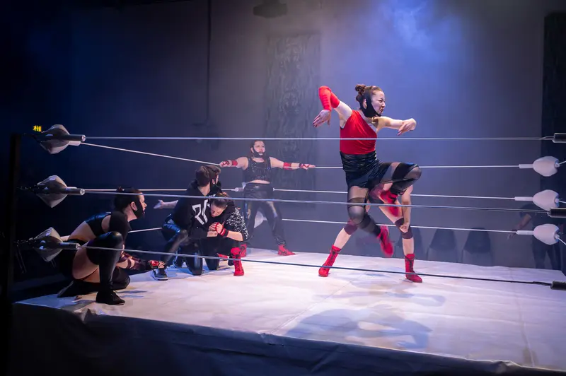 Wrestlers in Dynamic Performance at Kosmos Theater, Wien