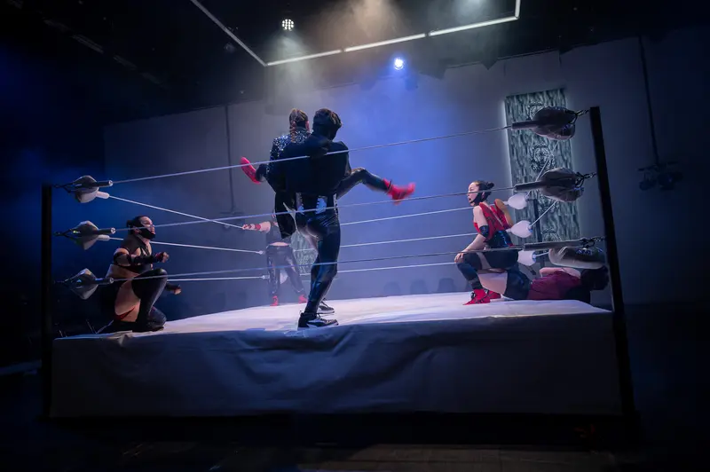 Wrestling Performers Engage in Dramatic Choreographed Combat at Kosmos Theater