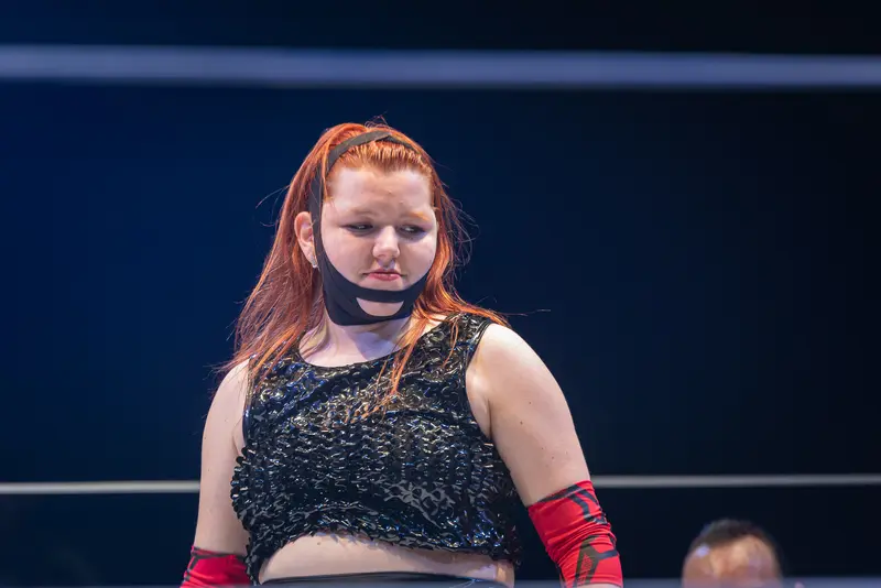 Wrestler in Red Gloves and Black Top at Kosmos Theater Performance