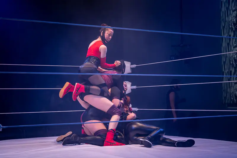 Professional Wrestling Match at Kosmos Theater with Dynamic Combat Sequence