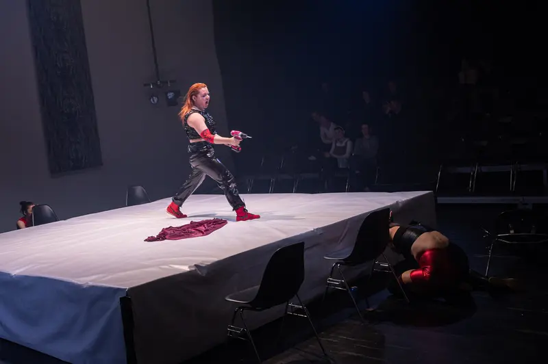 Performer on Stark Stage During "Keeping up with the Penthesileas" at Kosmos Theater