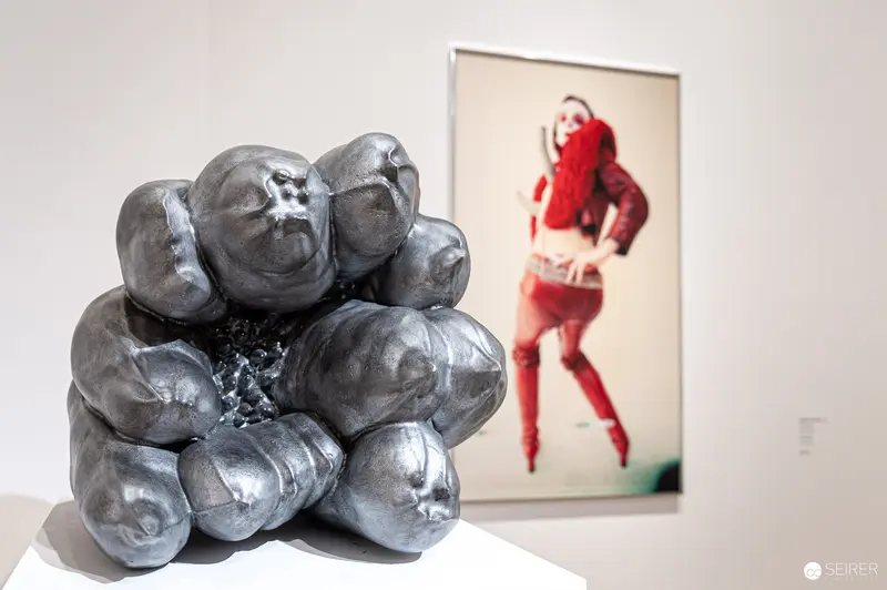 Silvery Ceramic Sculpture and Red-Clad Figure at Albertina Modern Exhibition