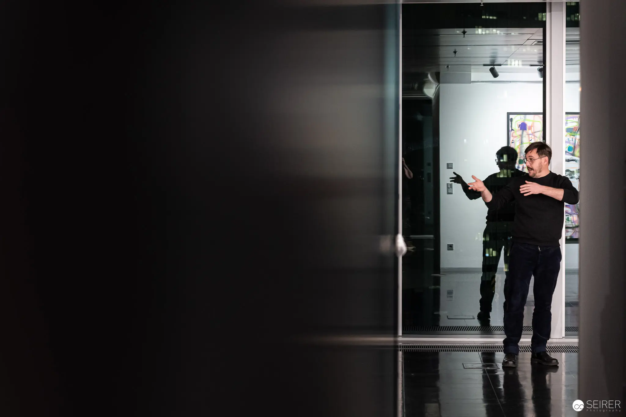 Grzegorz Siembida's "Storyteller" Exhibition: Performer in Black at Strabag Kunstforum