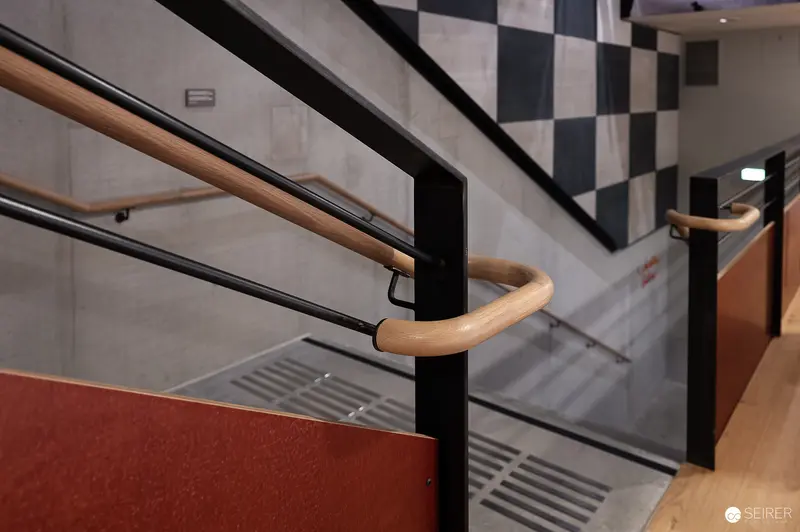 Architectural Detail of Staircase with Wooden Handrail at New Prater Museum
