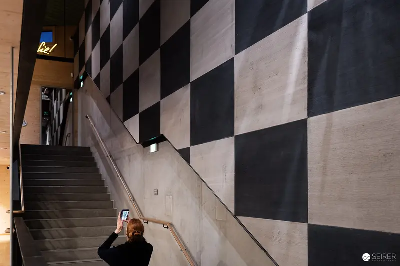 Prater Museum Staircase with Geometric Black and White Wall Design