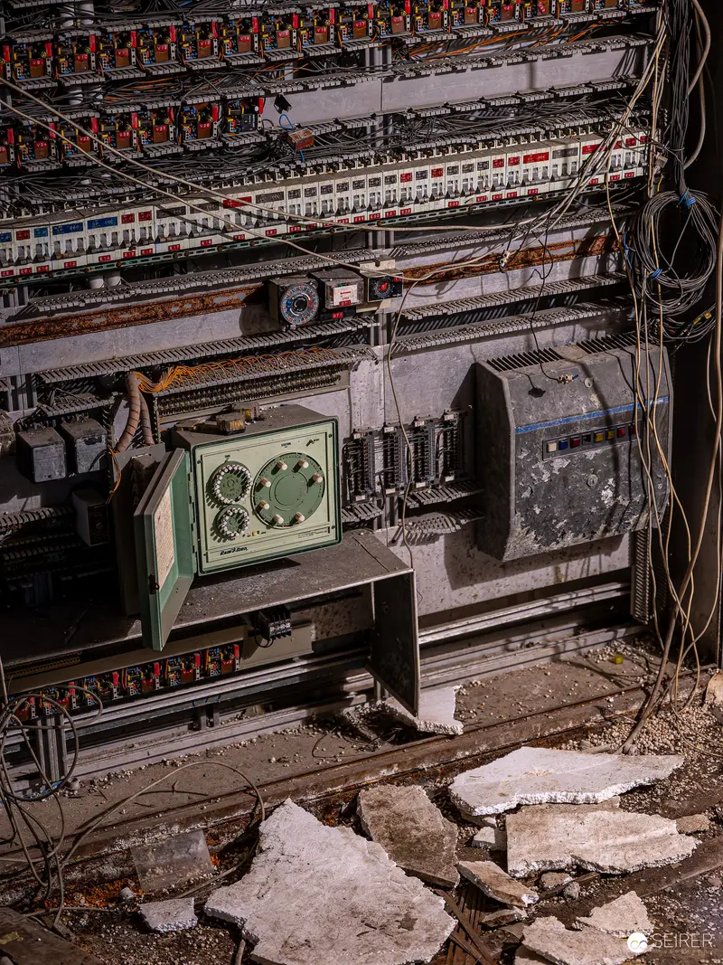 Industrial Decay: Abandoned Machinery and Concrete Fragments in Deteriorating Space