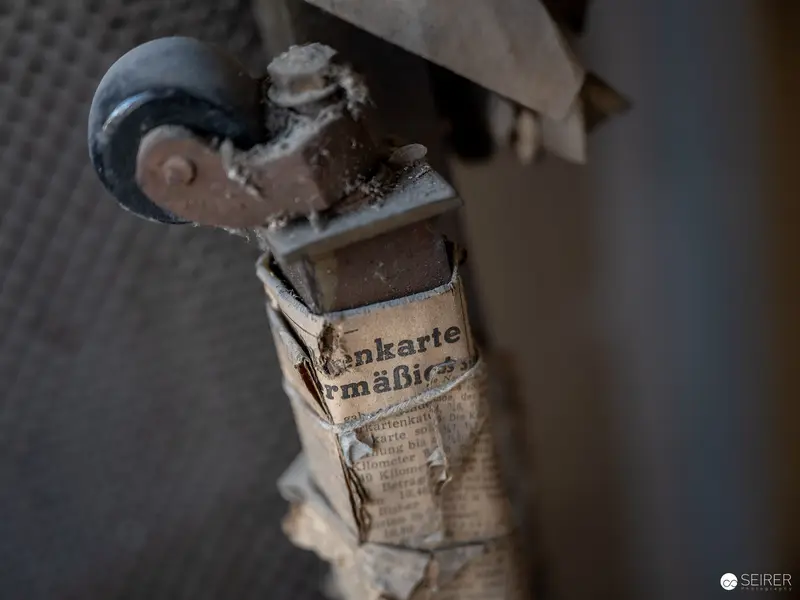 Weathered Newspaper-Wrapped Object from Art Exhibition Nocturnal Cave