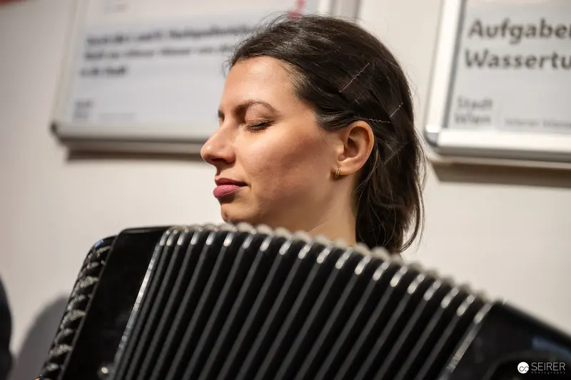 Musician Performing at "Lebensquelle Wasser" Exhibition Vernissage in Wasserturm Favoriten