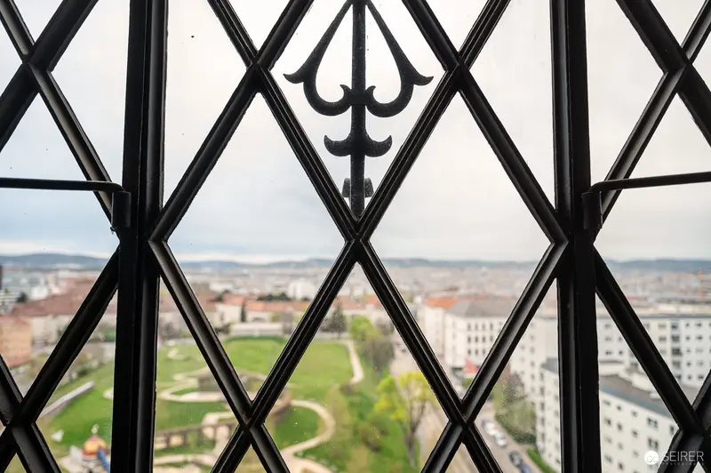 Ornate Window View of City Landscape through Decorative Leaded Glass