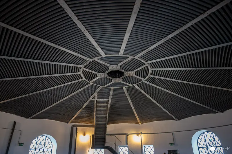 Intricate Wooden Ceiling and Staircase in Historic Water Tower Interior