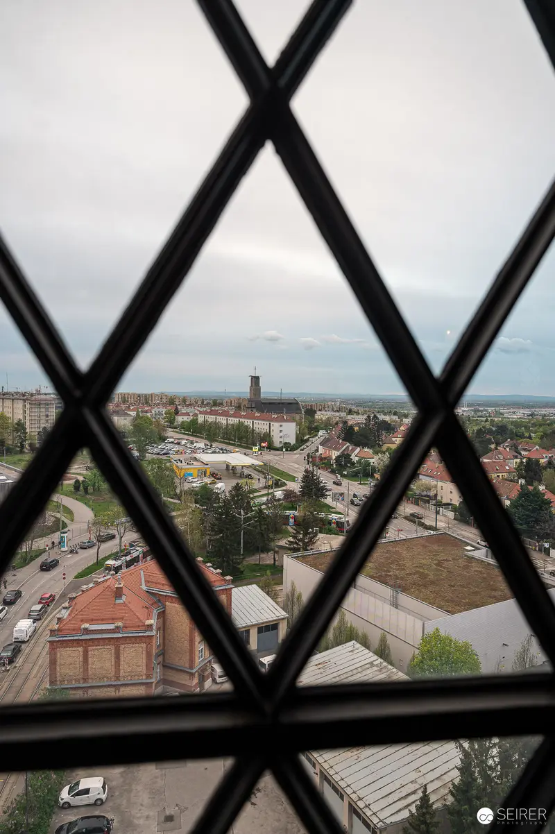 Urban Landscape Through Diamond-Paned Window in Residential Neighborhood