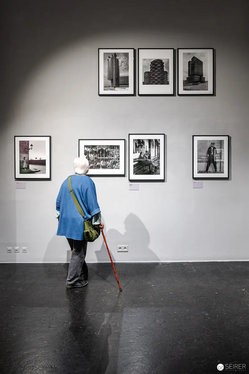 René Groebli Exhibition Visitor Examining Black and White Architectural Photography