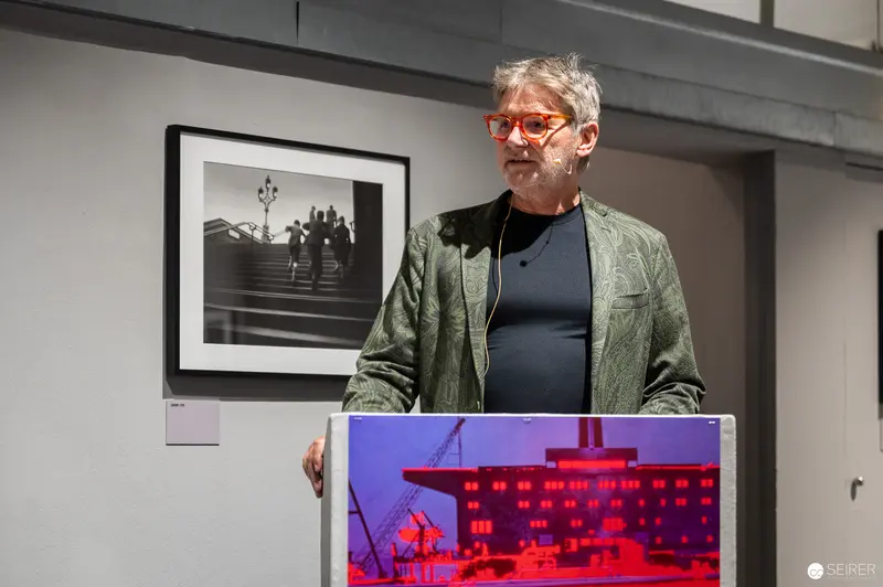 René Groebli Exhibition Opening at Westlicht Gallery, Featuring Photographer at Podium
